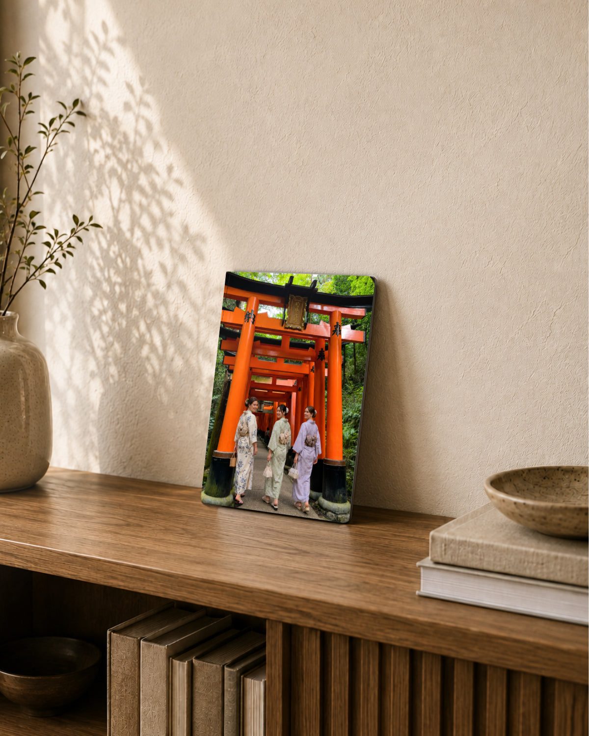 A Japan travel photo displayed as A4 metal art leaning on a shelf